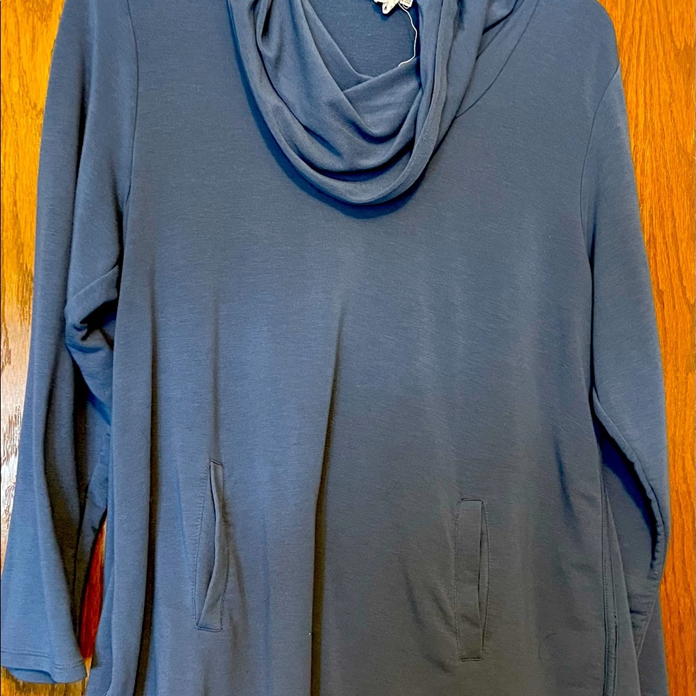1x blue tunic length top with cowl neck. Has pockets in front.